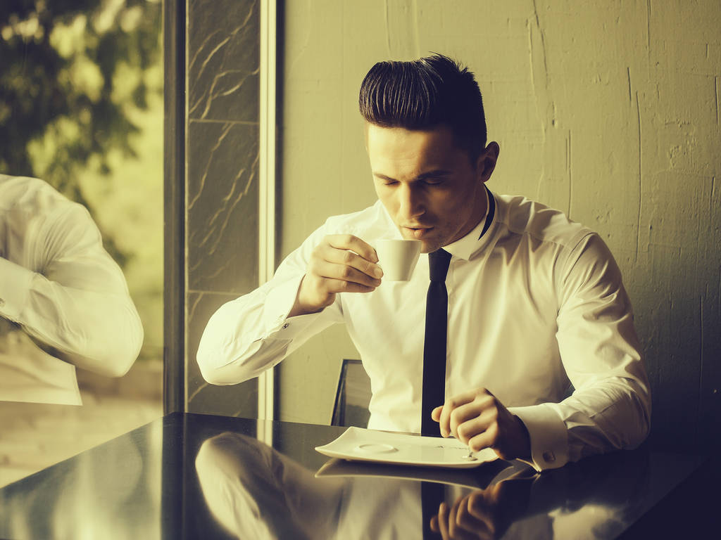 Young man drinks coffee  - Photo, Image