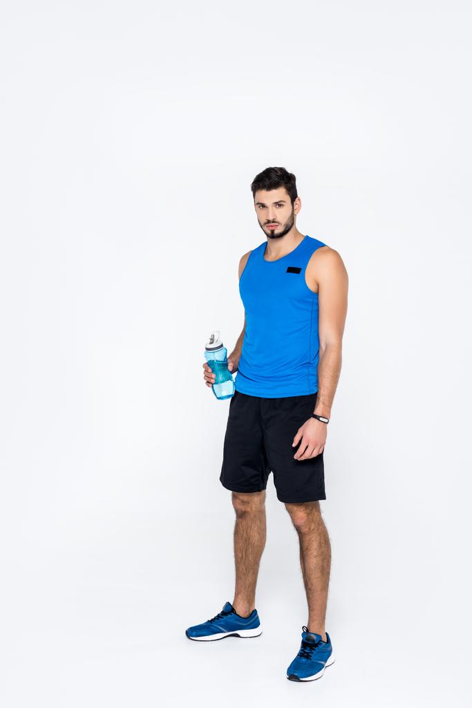 athletic young man with fitness bottle isolated on white - Photo, Image