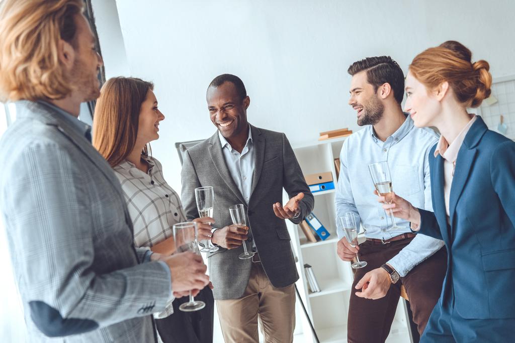 business team celebrating with beverage in glasses at office space  - Photo, Image