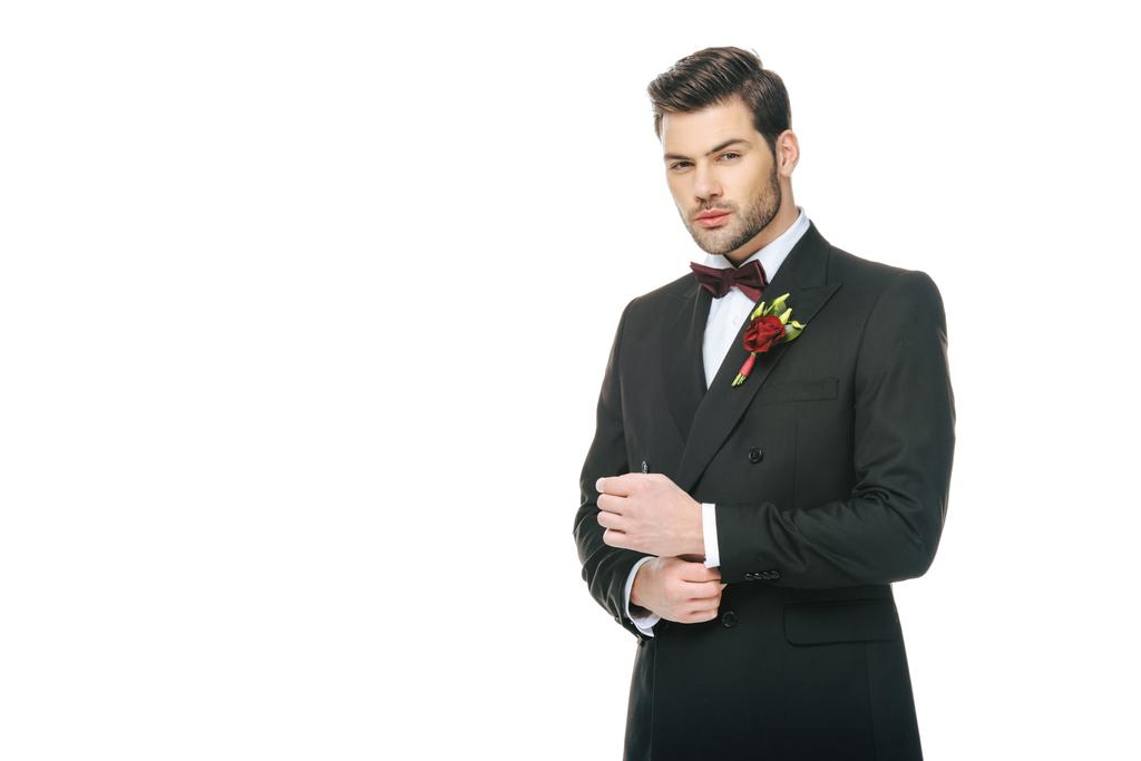 handsome young groom in suit with boutonniere isolated on white - Photo, Image