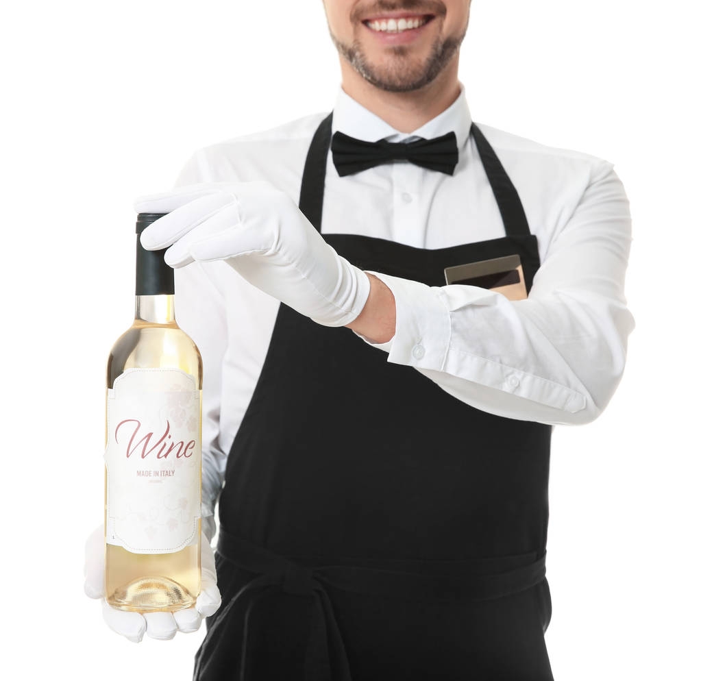 Красивый официант с бутылкой вина
  - Фото, изображение
