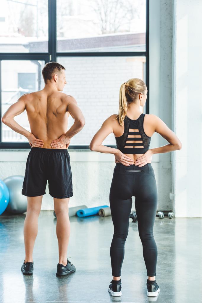 back view of couple warming up after workout in gym - Photo, Image