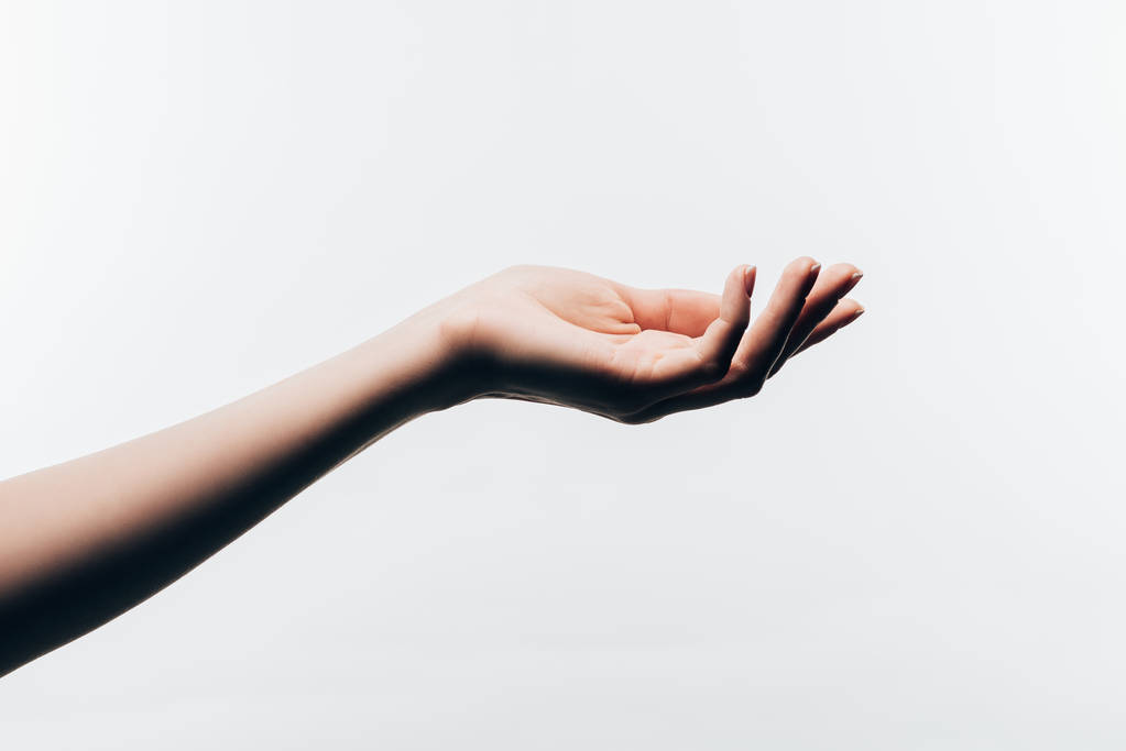 abgeschnittene Aufnahme der weiblichen Hand mit perfekter Haut isoliert auf Weiß - Foto, Bild