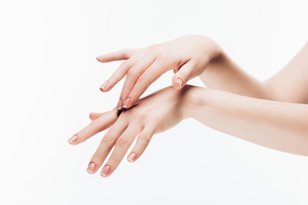 cropped shot of woman applying moisturizing cream on hands isolated on white - Photo, Image