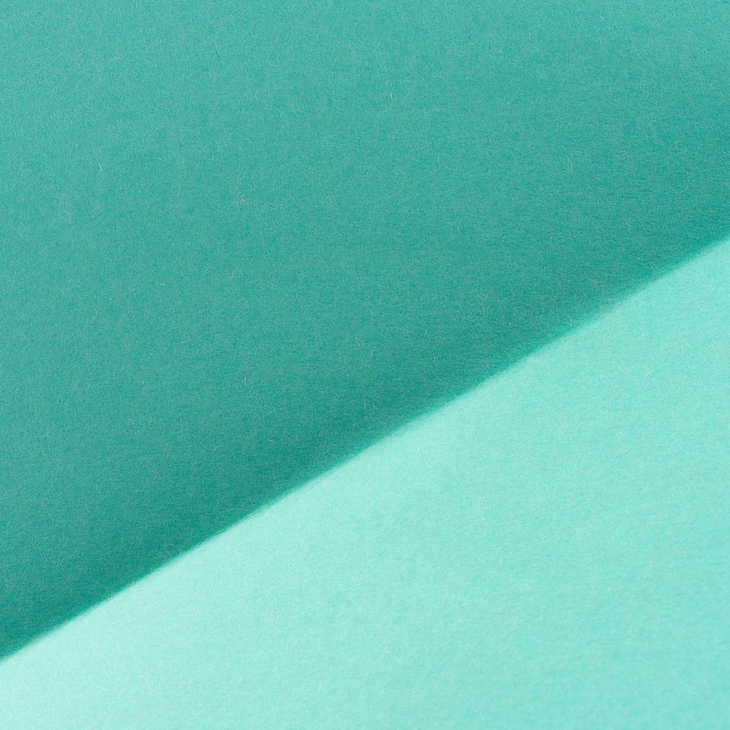 Close-up shot van turkooise kleur gevouwen papier voor achtergrond - Foto, afbeelding