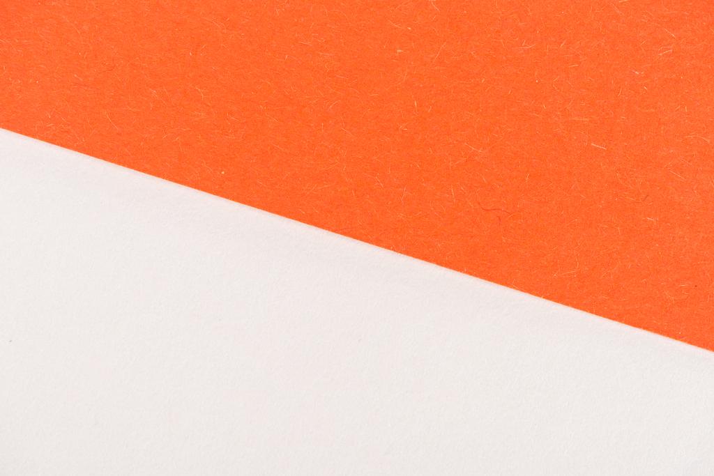 close-up shot of orange and white paper layers for background - Photo, Image