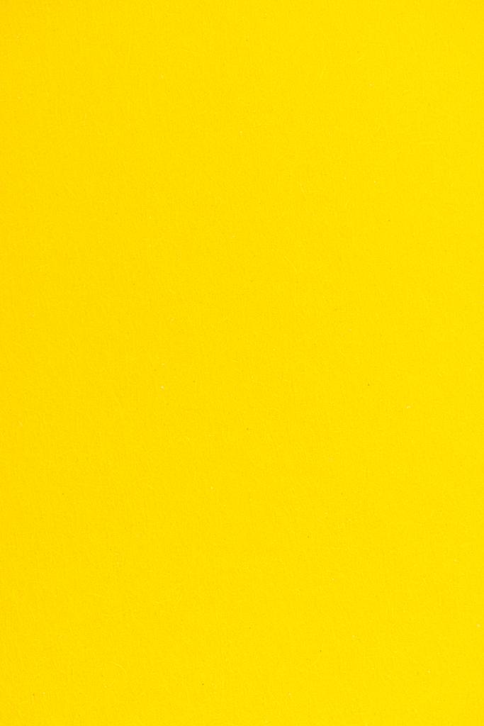Texture Of Yellow Color Paper As Background Free Stock Photo and Image