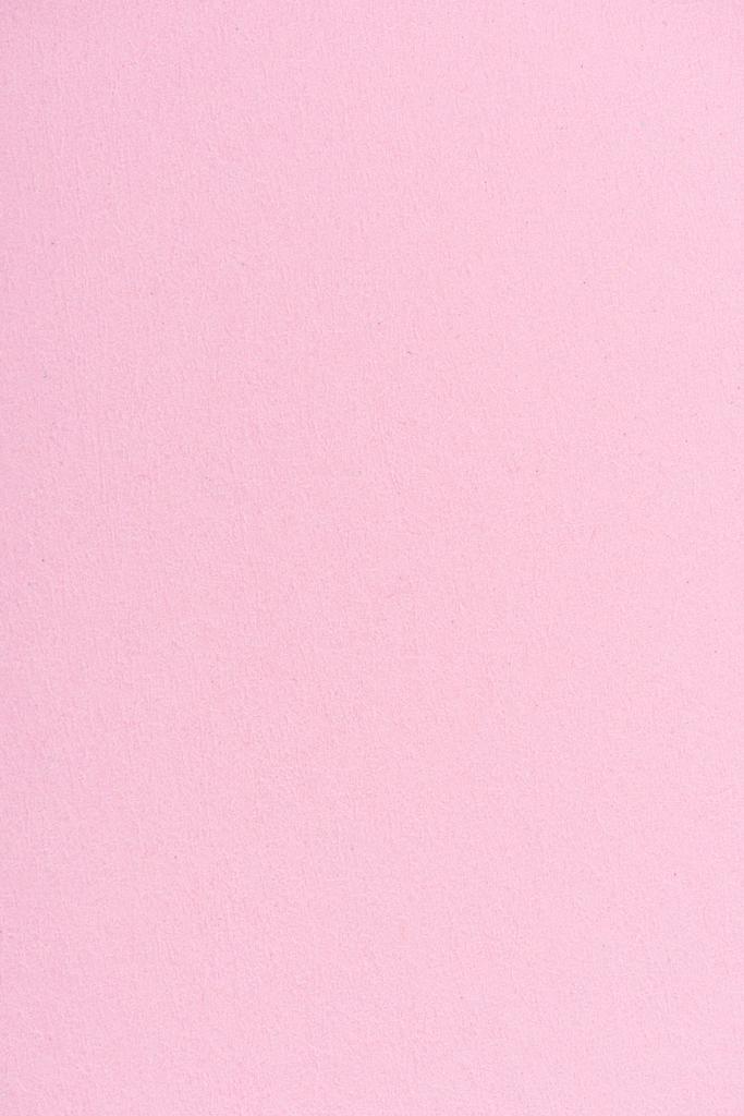 背景にピンク色の紙のテクスチャ ロイヤリティフリー写真 画像素材