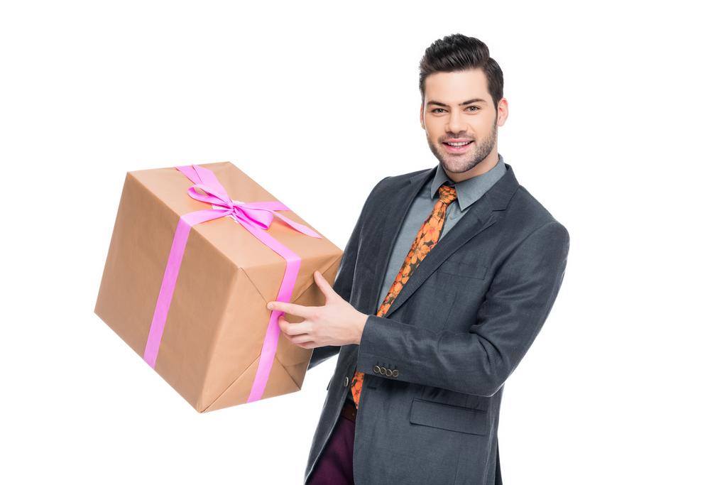 handsome bearded man holding gift box, isolated on white - Photo, Image