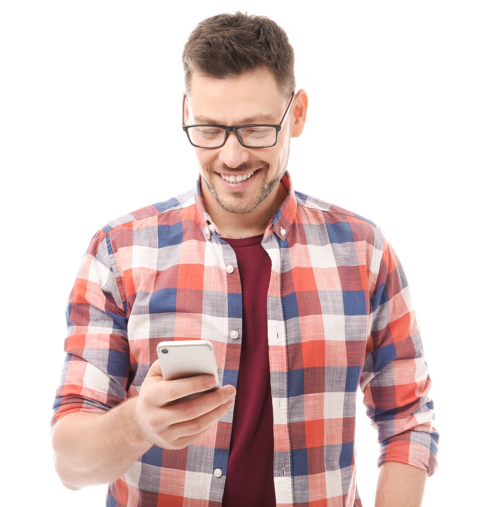 Привлекательный молодой человек с мобильным телефоном на белом фоне
 - Фото, изображение