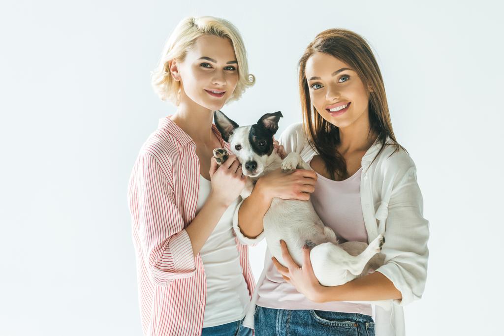 beautiful smiling girls with jack russell terrier dog, isolated on white - Photo, Image