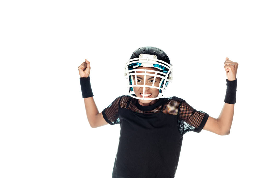agressief vrouwelijke american football speler geïsoleerd op wit - Foto, afbeelding