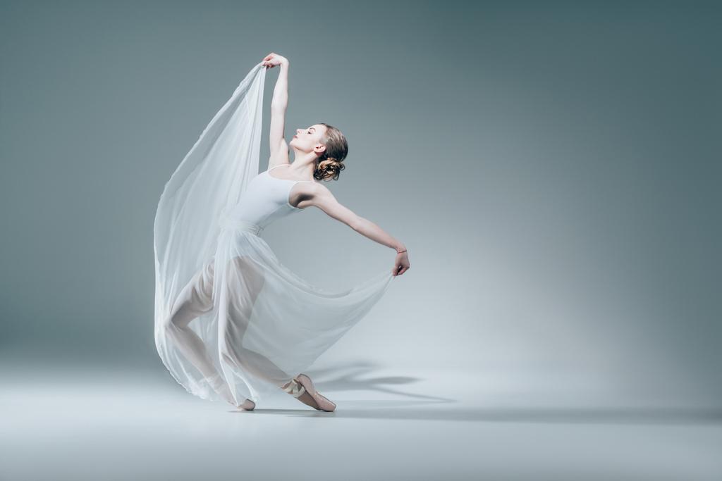 attractive ballerina dancing in white dress - Photo, Image