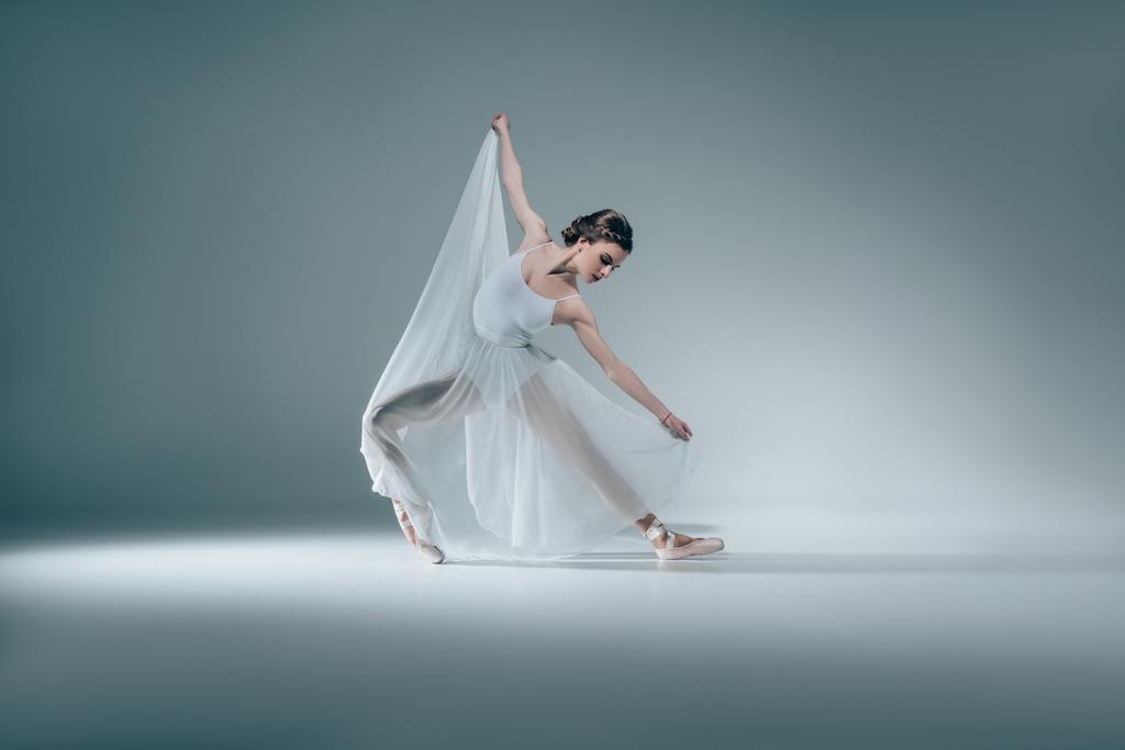 elegant beautiful ballerina dancing in white dress - Photo, Image
