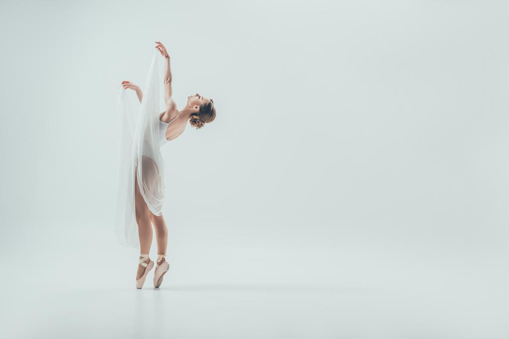 beautiful elegant ballerina dancing in studio, isolated on white - Photo, Image