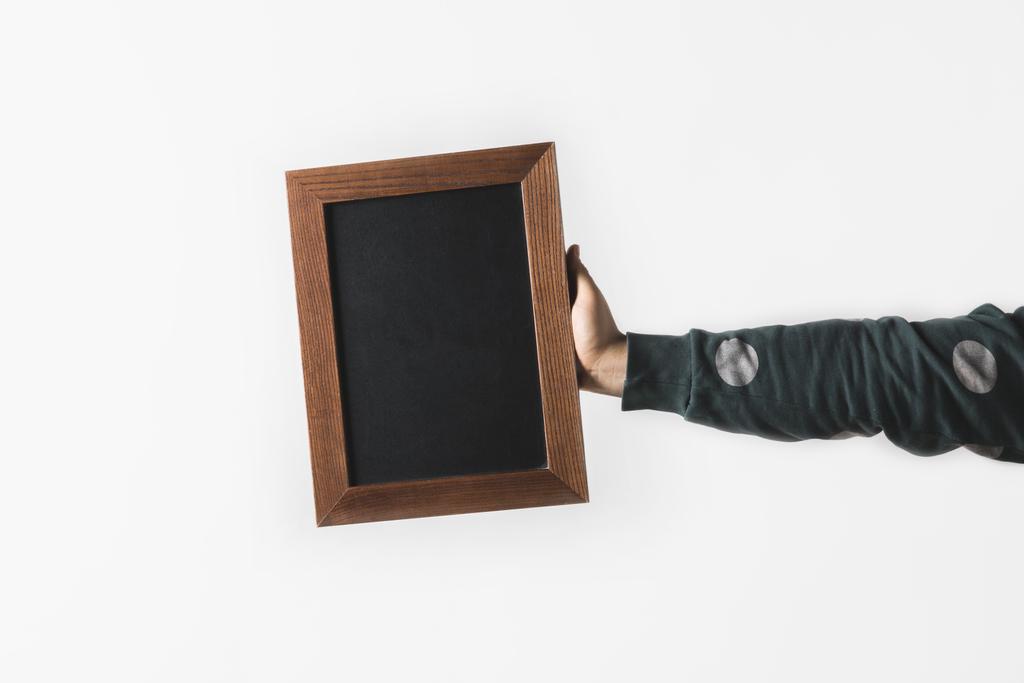 cropped image of man holding empty black board isolated on white - Photo, Image