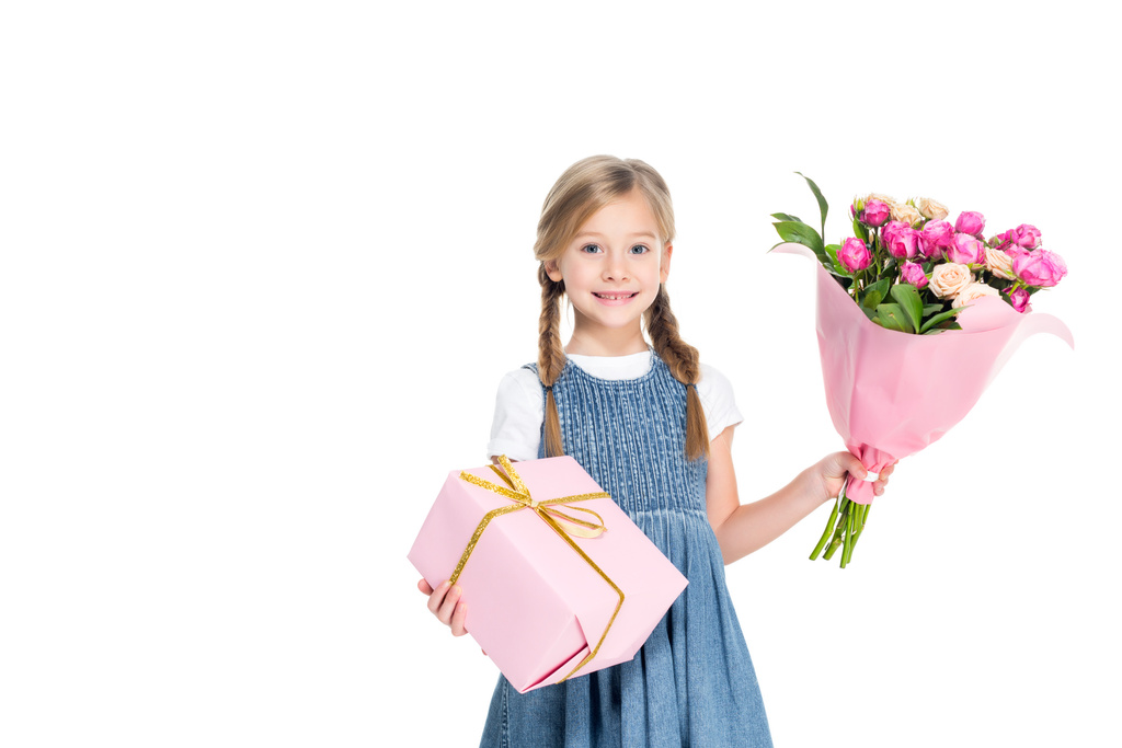 smiling kid with girl and bouquet of flowers, isolated on white - Photo, Image