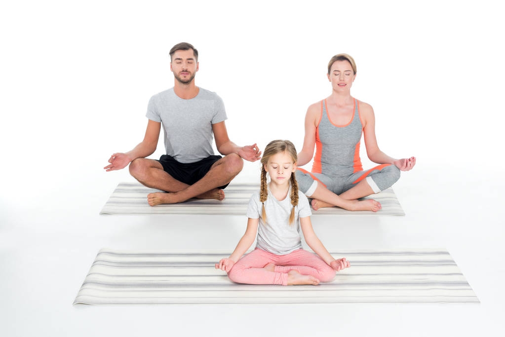 athletic family practicing yoga on mats together isolated on white - Photo, Image