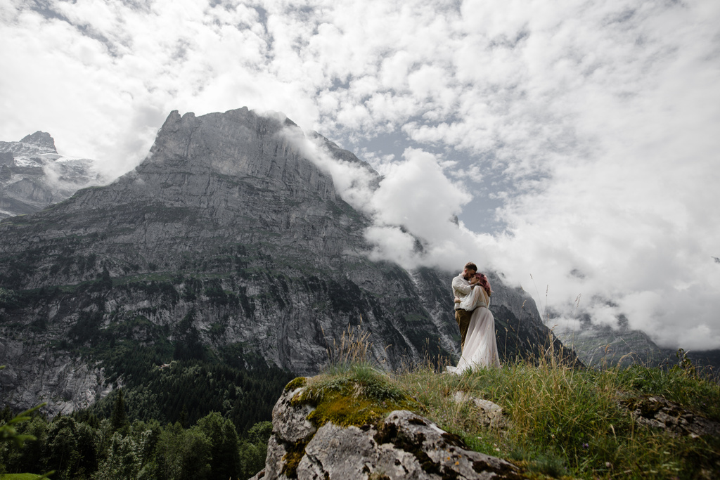 beautiful young wedding couple hugging in majestic mountains, Alps - Photo, Image