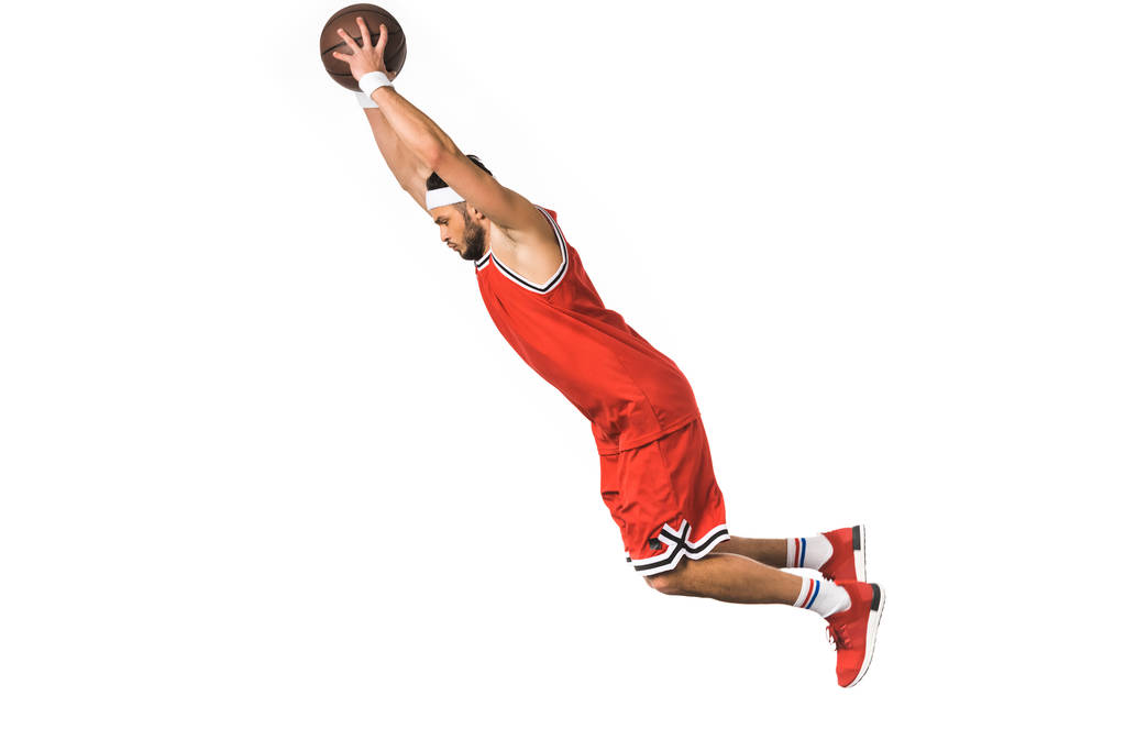 side view of young basketball player with ball jumping isolated on white - Photo, Image