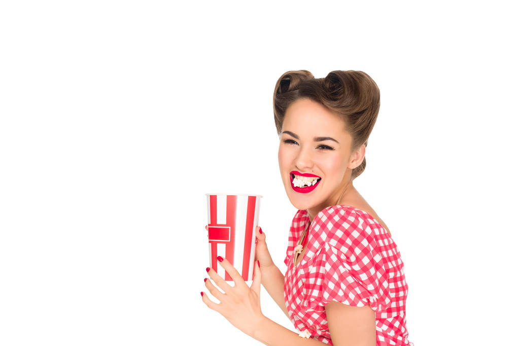 portrait of stylish young woman eating popcorn isolated on white - Photo, Image