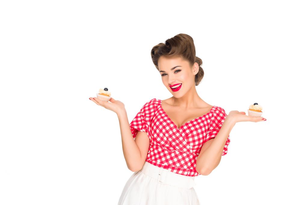 portrait of beautiful woman in pin up clothing with cupcakes isolated on white - Photo, Image