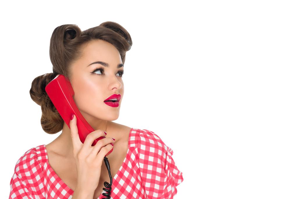 portrait of pin up woman talking on old telephone isolated on white - Photo, Image
