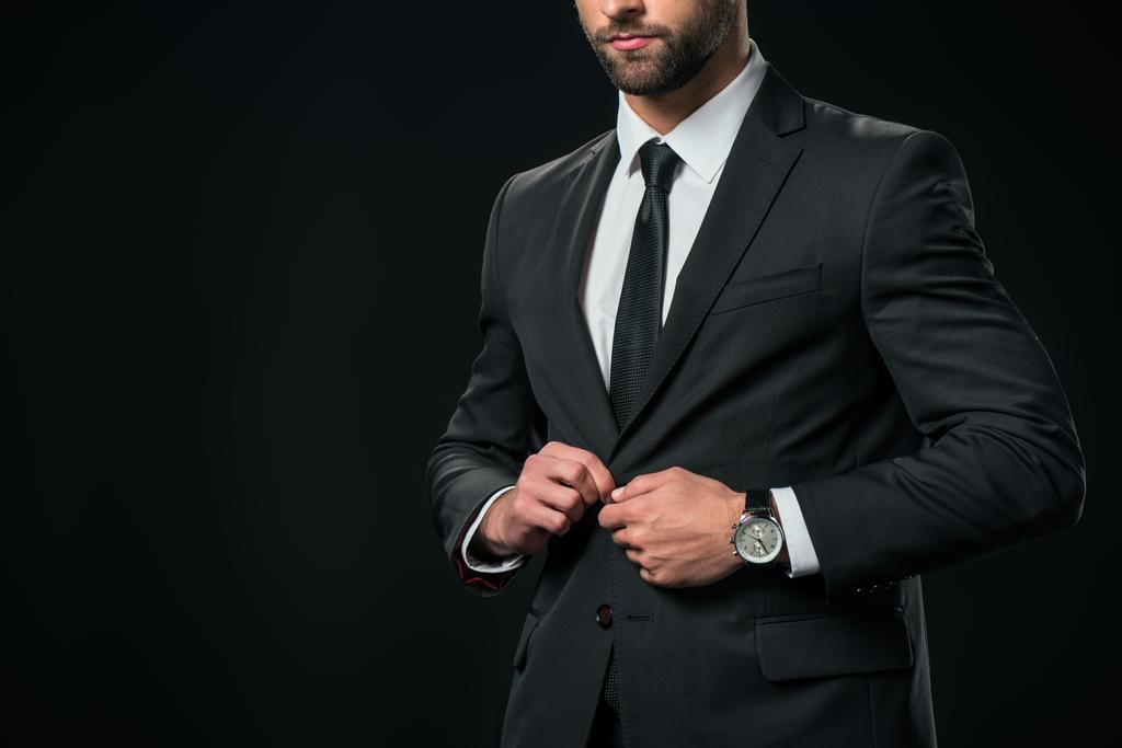vista recortada de hombre de negocios en chaqueta, aislado en negro
 - Foto, Imagen