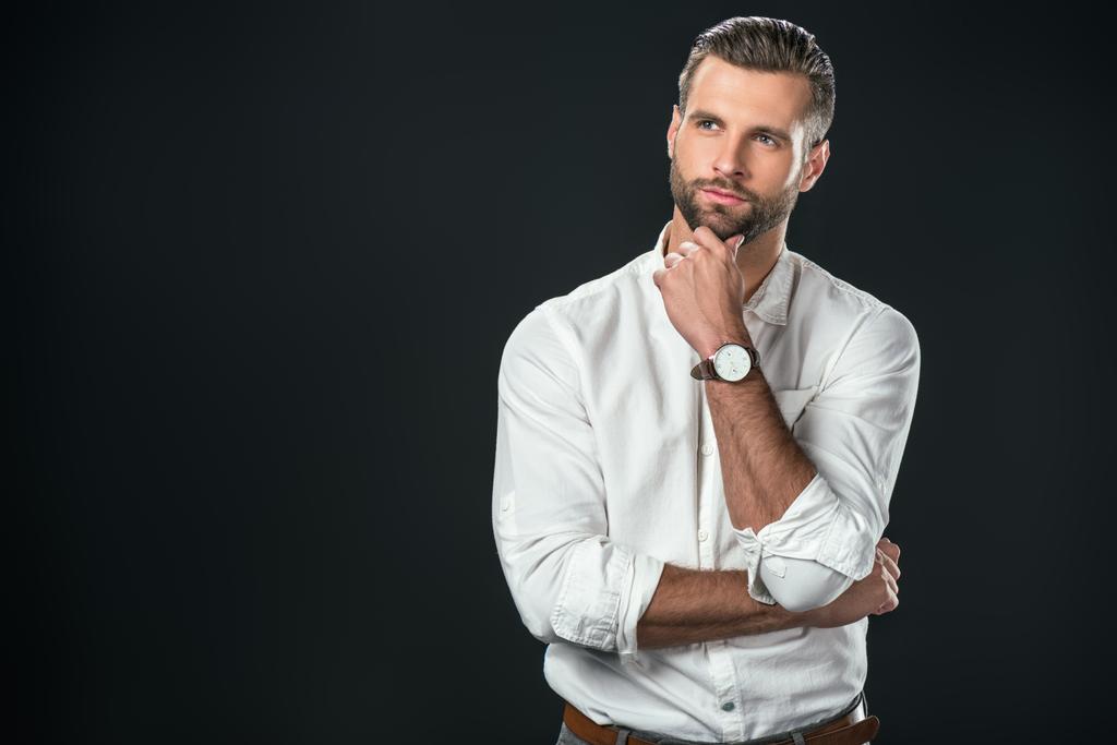 handsome thoughtful businessman in white shirt, isolated on black - Photo, Image