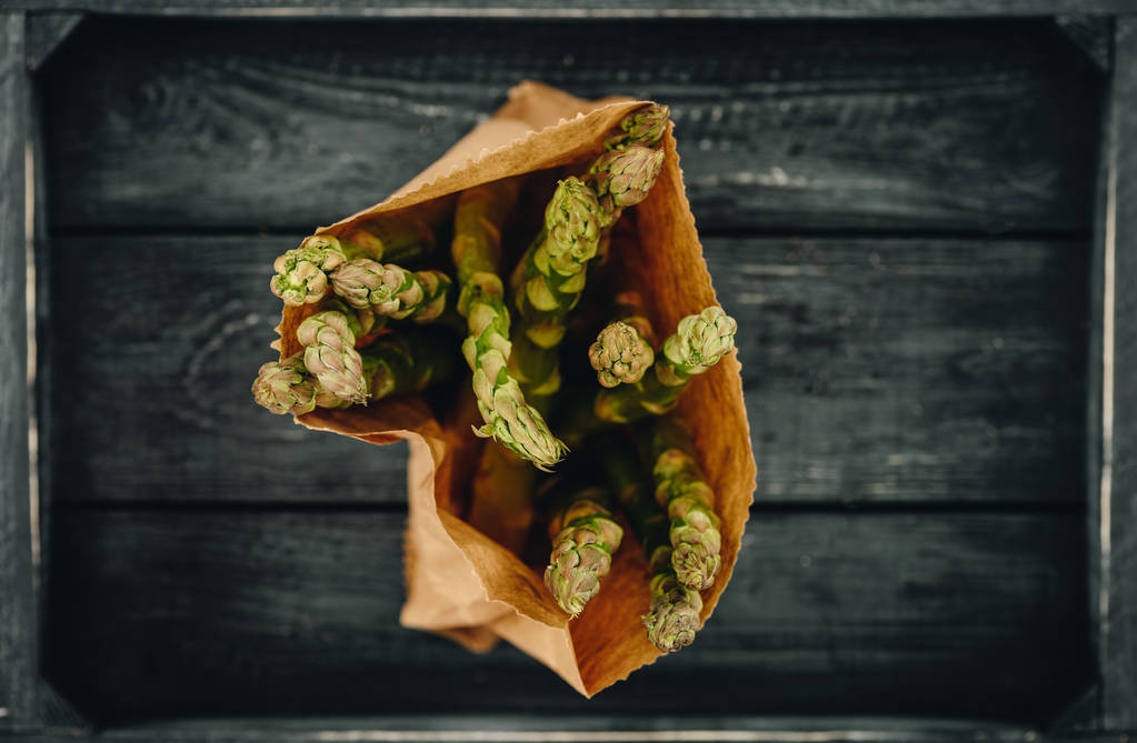 top view of asparagus in shopping paper bag - Photo, Image