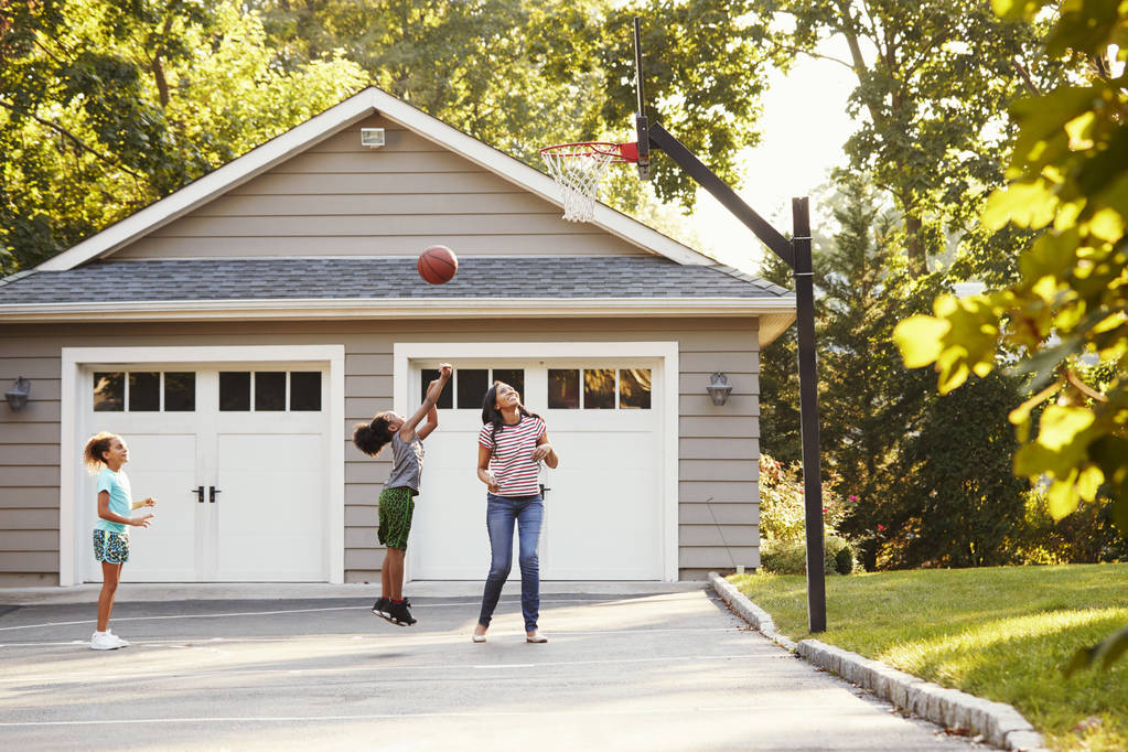 Mother And Children Playing Basketball On Driveway At Home - Photo, Image