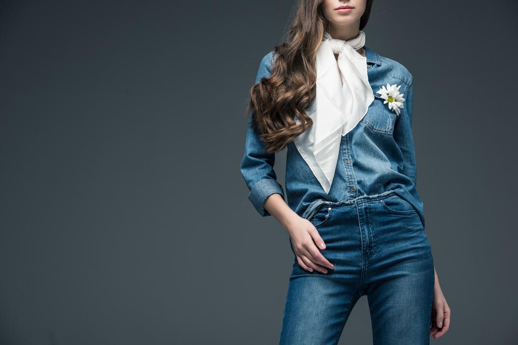 cropped view of girl with long hair posing in scarf and denim shirt with flowers, isolated on grey - Photo, Image