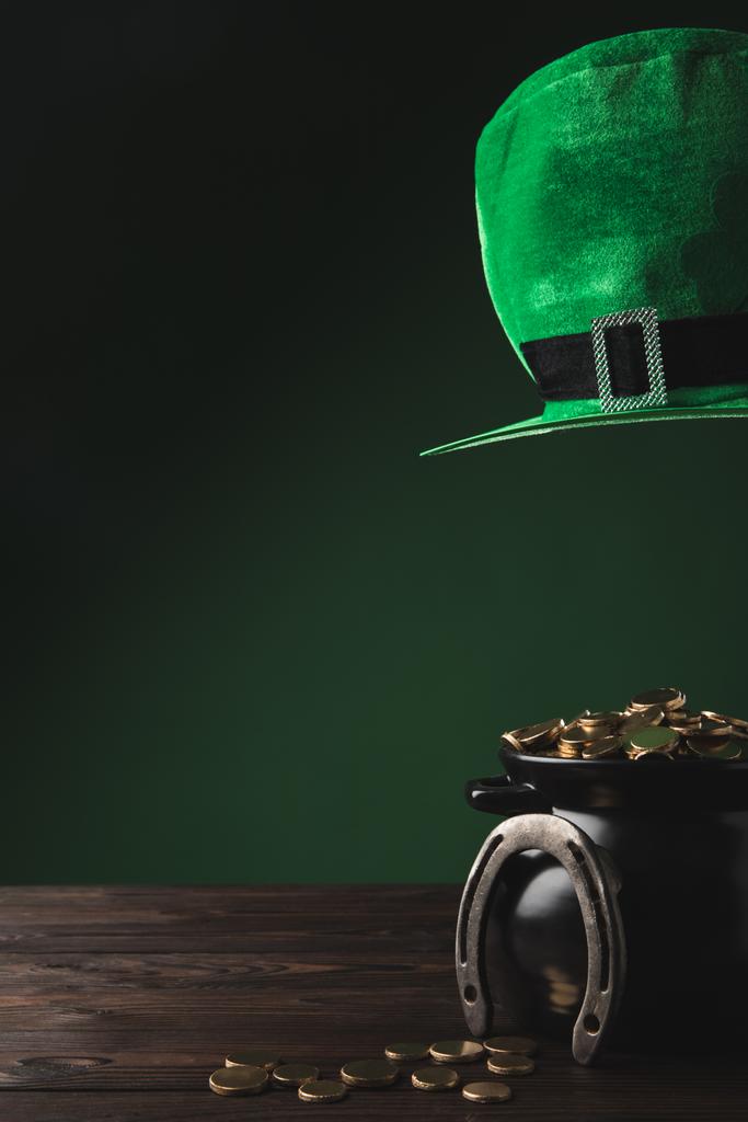 pot with golden coins, horseshoe and green hat, st patricks day concept - Photo, Image