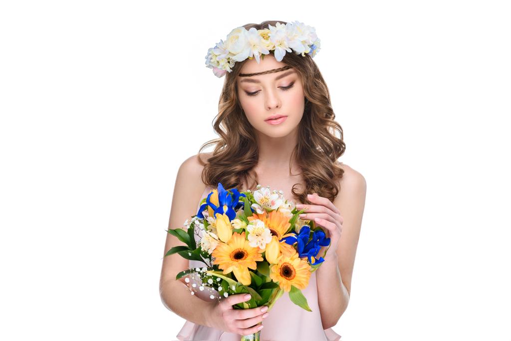 young woman in floral wreath with bouquet isolated on white - Photo, Image