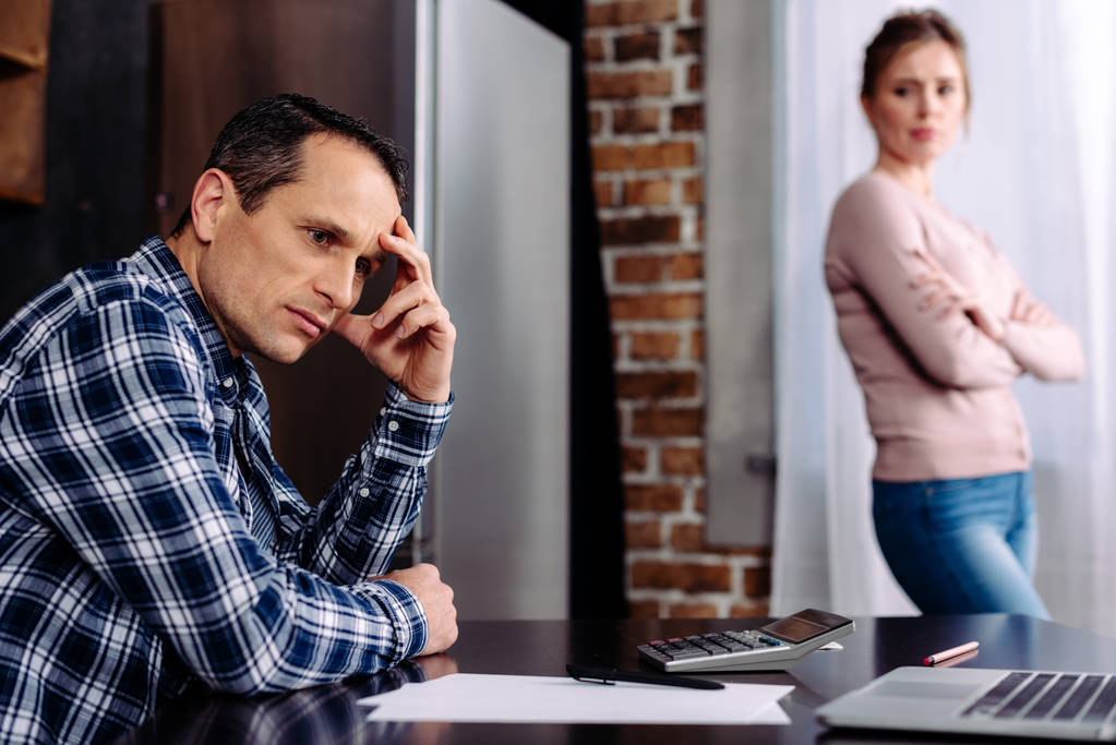 selective focus of argued couple in kitchen at home, financial problems concept - Photo, Image