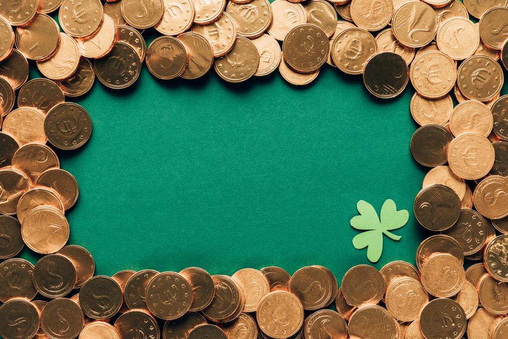 top view of golden coins and shamrock on green table, st patricks day concept - Photo, Image