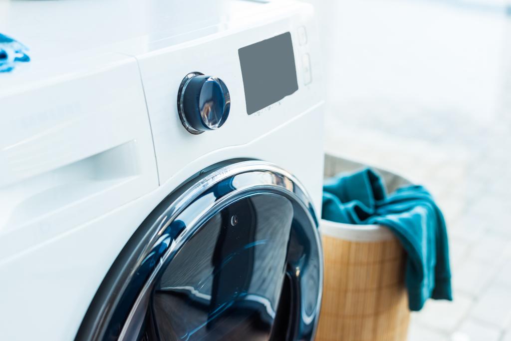 close-up view of modern washing machine and basket with laundry at home - Photo, Image