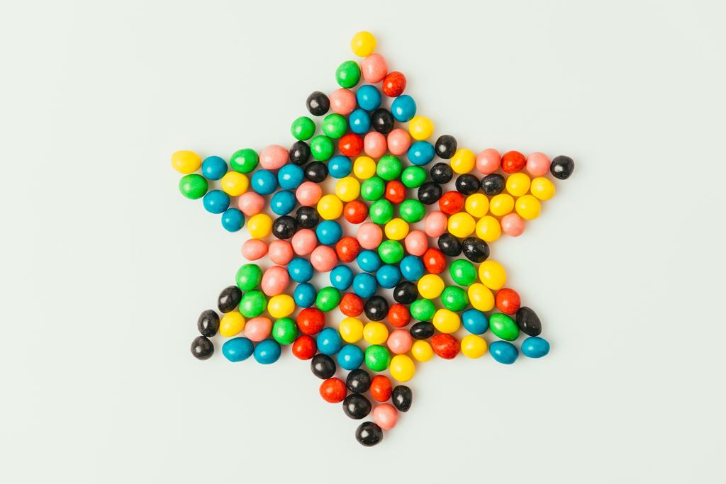 top view of star made of sweets isolated on grey, purim holiday concept - Photo, Image