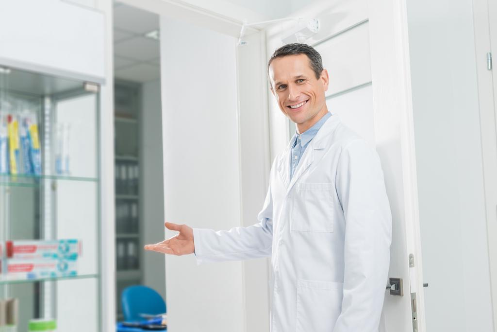 Doctor inviting patient to modern clinic - Photo, Image