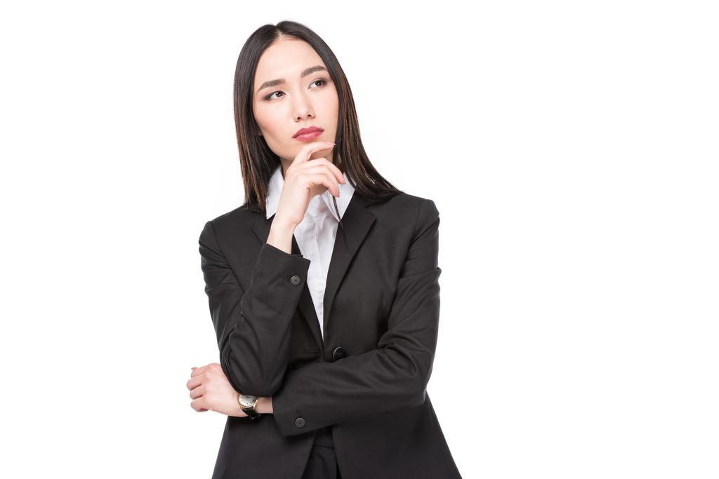 portrait of pensive asian businesswoman in suit isolated on white - Photo, Image
