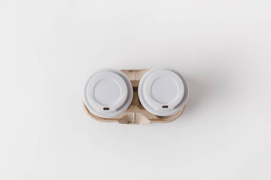 top view of coffee in paper cups in cardboard tray on tabletop - Photo, Image