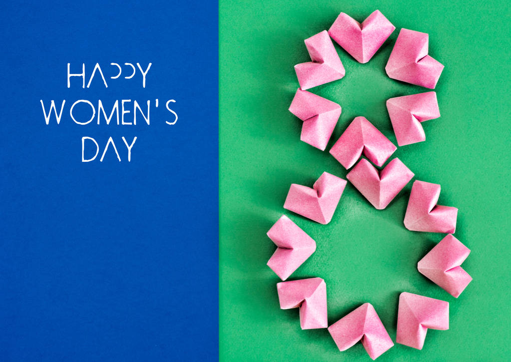 Boldog nemzetközi női napot ünnepelni március 8-án, gratuláló kártya rose színes papír szív alakú nyolcas 8 fehér háttér  - Fotó, kép
