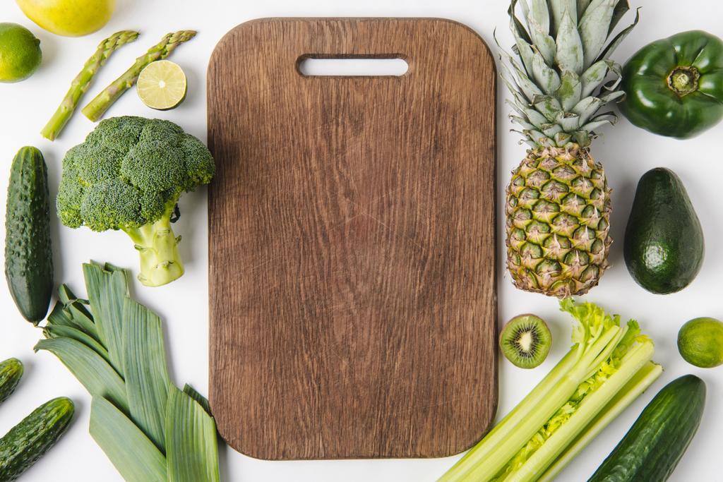 Vegetables And Greens With Wooden Cutting Board. Healthy Food Background  Stock Photo, Picture and Royalty Free Image. Image 80150842.