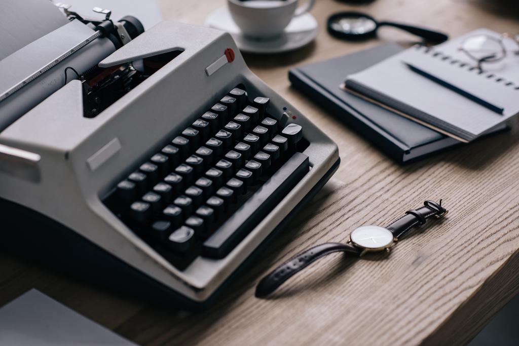 close-up shot of writer workplace with typewriter and watch - Photo, Image