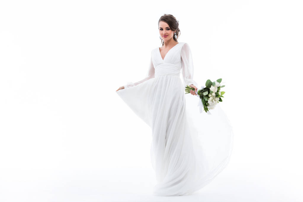 houkutteleva morsian poseeraa valkoinen mekko häät kukkakimppu, eristetty valkoinen
 - Valokuva, kuva