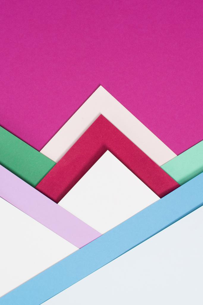 colored different triangles isolated on pink - Photo, Image