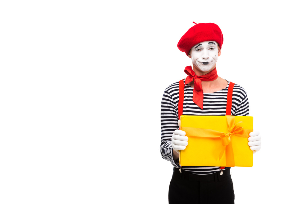 grimacing mime showing gift box isolated on white - Photo, Image