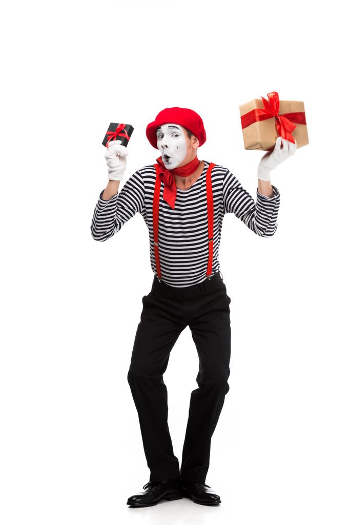 mime grimacing and holding present boxes isolated on white - Photo, Image