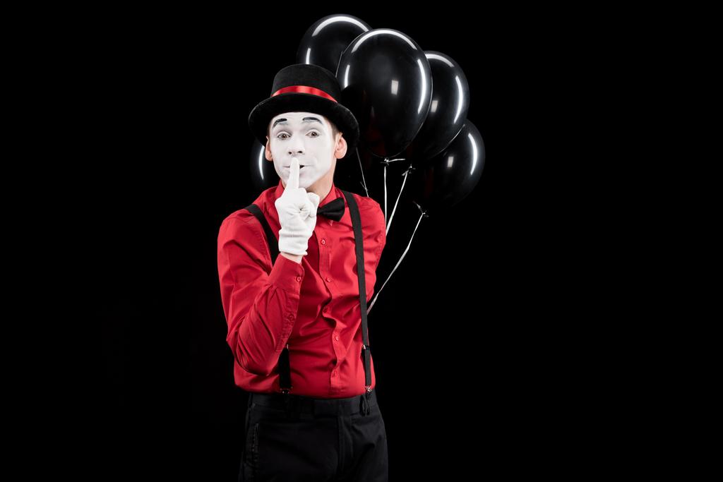 mime holding balloons and showing silence sign isolated on black - Photo, Image