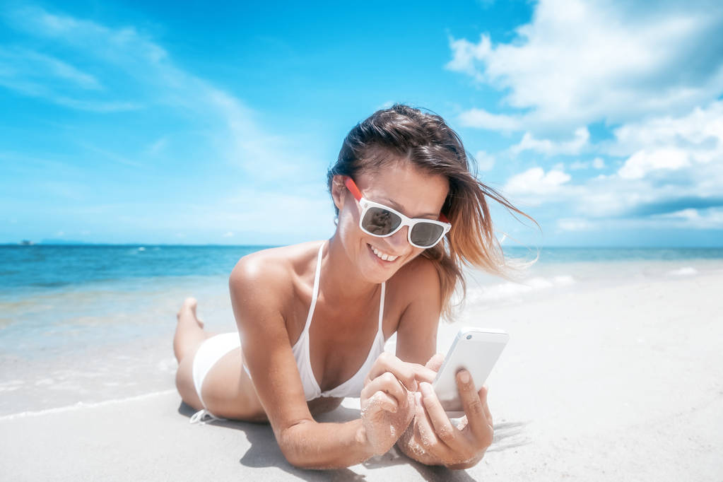 Beautiful young woman in a white bikini on a beautiful paradise  - Photo, Image